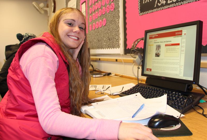 Monroe Virtual High School student smiles as she works